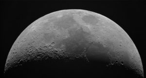 Grainy black-and-white lunar photograph with five circled areas labeled Area 1 through Area 5 above the horizon.