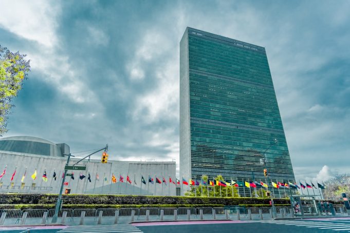 UN General Assembly chamber with electronic voting board showing 93-24 tally to suspend Russia from Human Rights Council