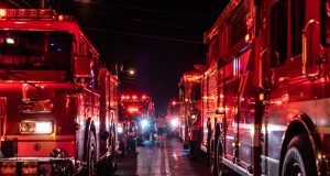 Hong Kong Probes New Lucky House Fire Safety Failures Fire crews outside the scorched New Lucky House on Nathan Road, Jordan, after the deadly April 2024 blaze.