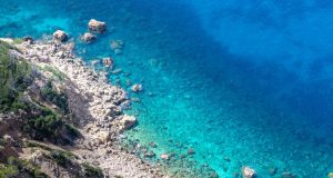 27 Migrants Die as Boats Capsize off Tunisia’s Kerkennah Rescue workers pull survivors from rough seas beside a capsized wooden boat off low-lying Kerkennah Islands.
