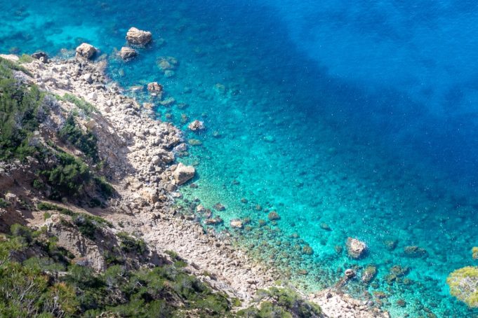 Tunisian Island Boat Capsizes Kill 27 Migrants, 83 Rescued Rescue workers pull survivors from rough seas beside a capsized wooden boat off low-lying Kerkennah Islands.